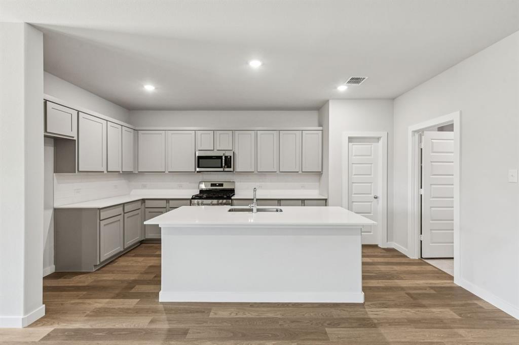 361 Yellowstar Lane Lavon, TX 75166 - Photo 7 of 33 Kitchen in the Oscar home plan by Trophy Signature Homes – REPRESENTATIVE PHOTO
