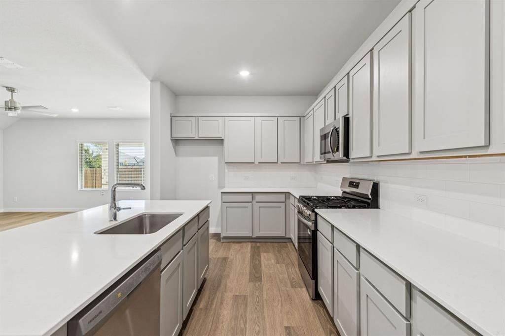 361 Yellowstar Lane Lavon, TX 75166 - Photo 8 of 33 Kitchen in the Oscar home plan by Trophy Signature Homes – REPRESENTATIVE PHOTO