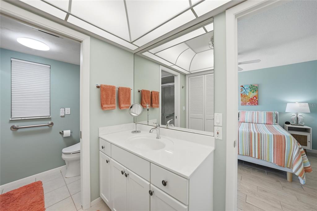 1 Colony Point Drive, Unit A10 Punta Gorda, FL 33950 - Photo 18 of 31 a bathroom with a sink and a mirror