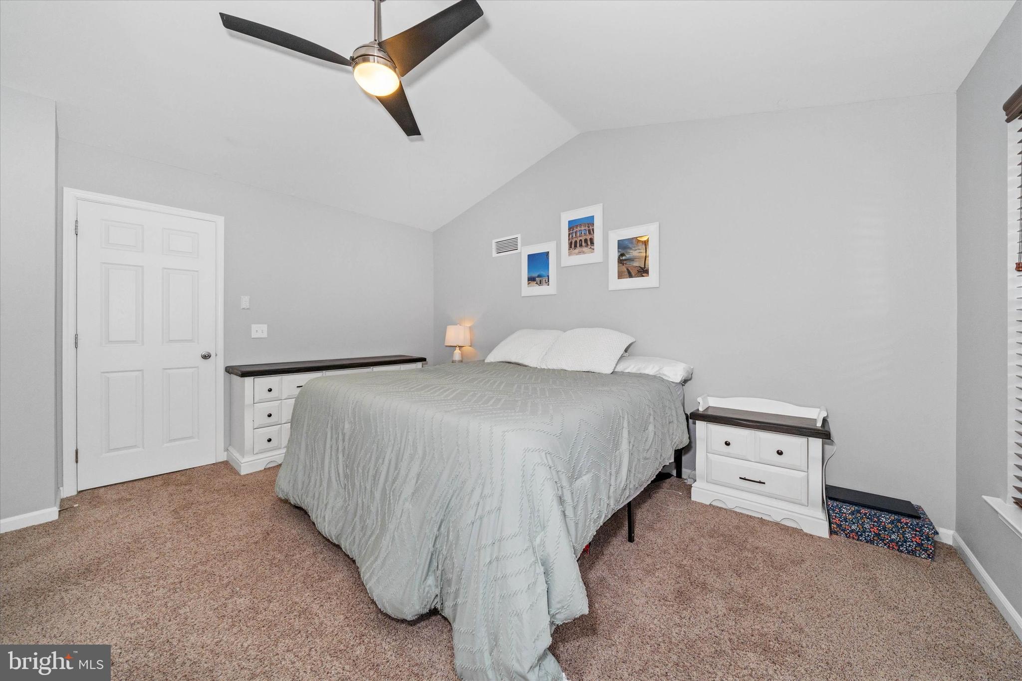 337 Norman Drive Newark, DE 19702 - Photo 16 of 33 a bedroom with a bed and a chandelier