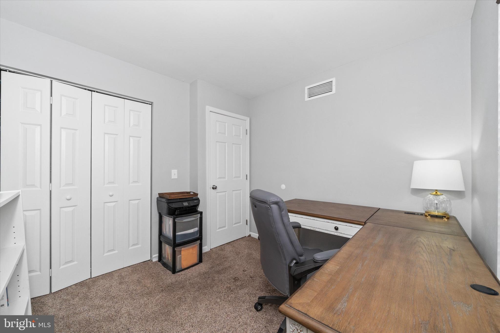 337 Norman Drive Newark, DE 19702 - Photo 22 of 33 a bed room with a bed and a lamp