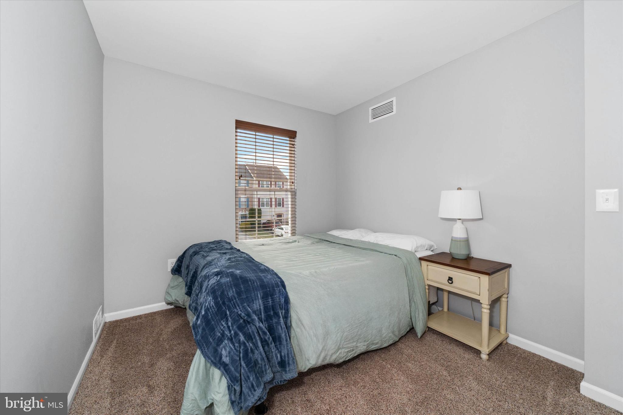 337 Norman Drive Newark, DE 19702 - Photo 23 of 33 a bedroom with a bed and a window