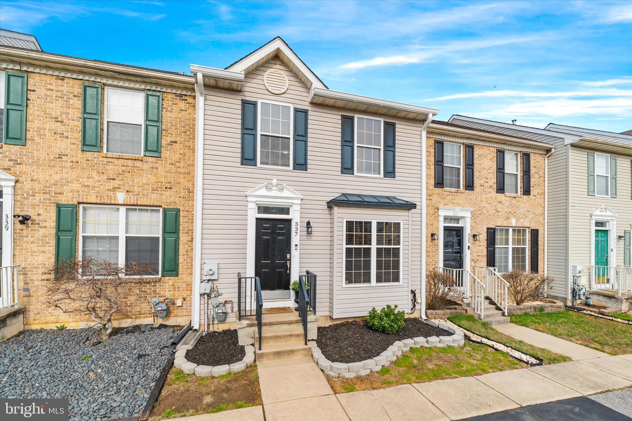 337 Norman Drive Newark, DE 19702 - Photo 3 of 33 a view of a brick house with many windows