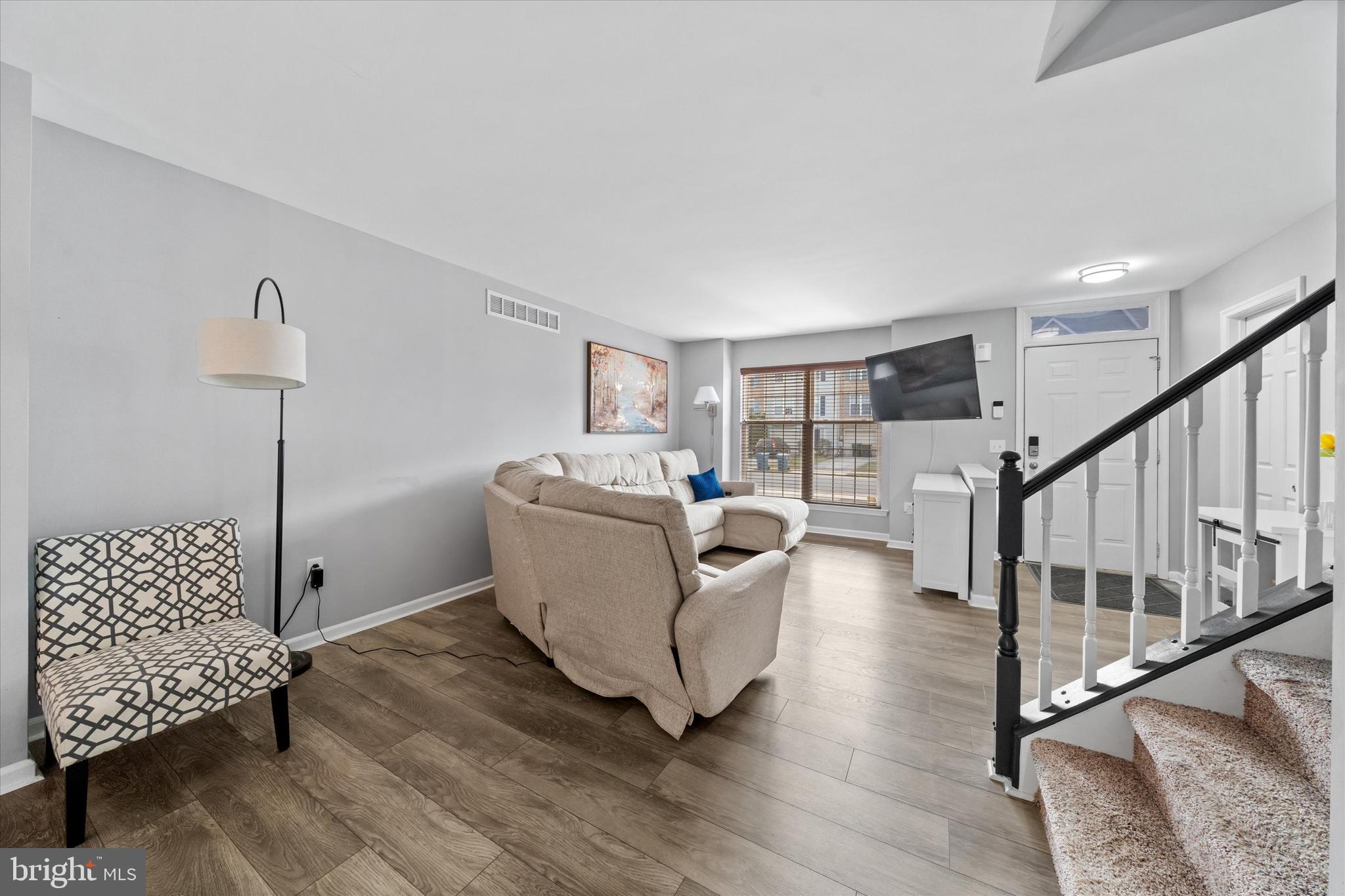337 Norman Drive Newark, DE 19702 - Photo 7 of 33 a living room with furniture and a wooden floor