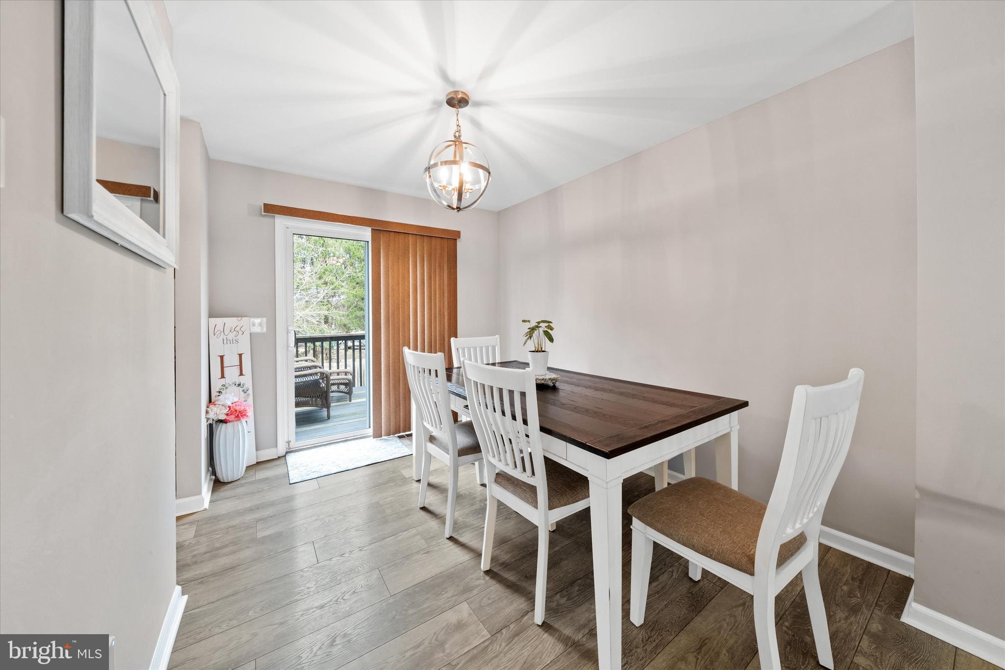 337 Norman Drive Newark, DE 19702 - Photo 9 of 33 a view of a dining room with furniture window and wooden floor