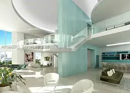 a living room with furniture and a dining table