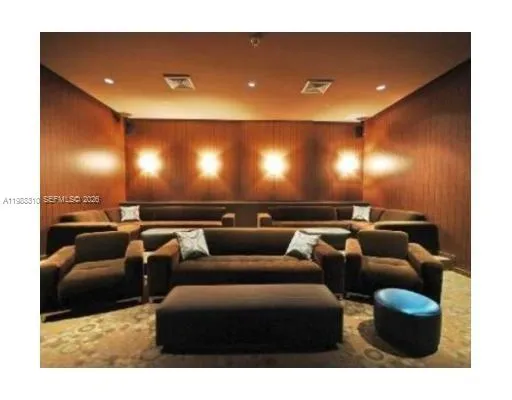 a media room with lots of chairs and a projector