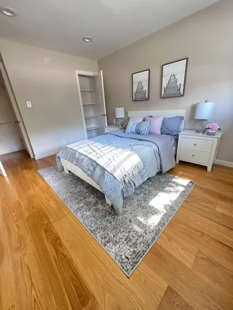 a bedroom with a bed and a walk in closet