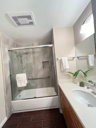 a bathroom with a sink and a mirror