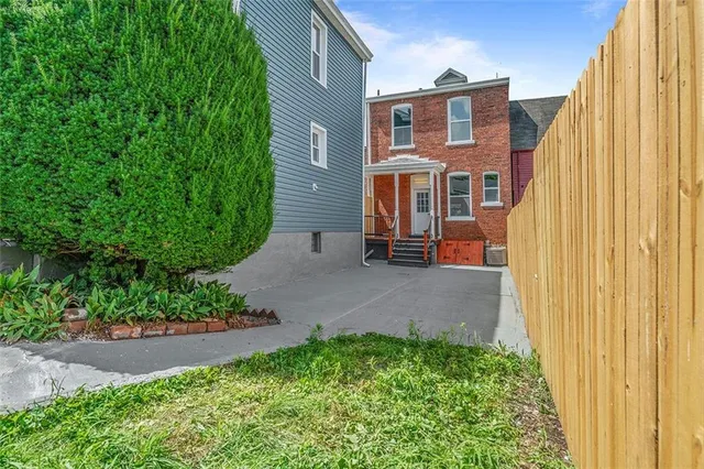 a view of a house with a street