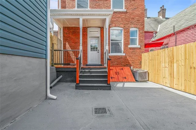 a bathroom with a granite countertop toilet sink and mirror