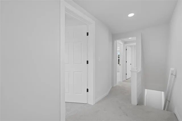 a view of a hallway with staircase