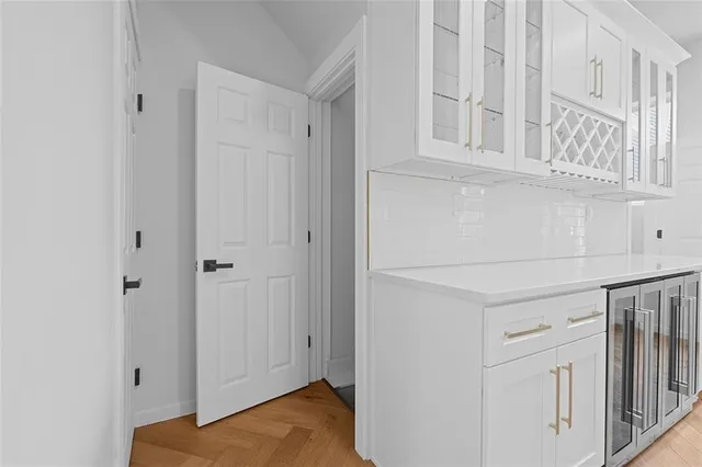 a kitchen with stainless steel appliances a sink stove and cabinets