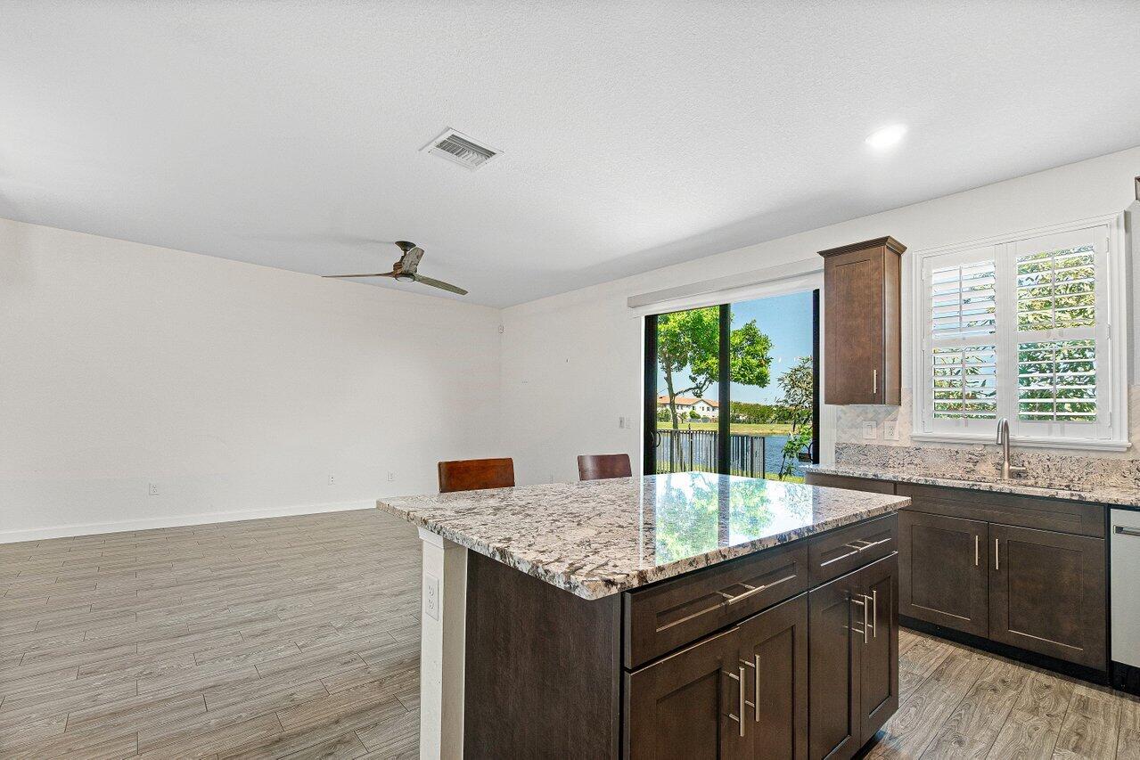 12949 Anthorne Lane Boynton Beach, FL 33436 - Photo 14 of 37 a kitchen with a sink and large window