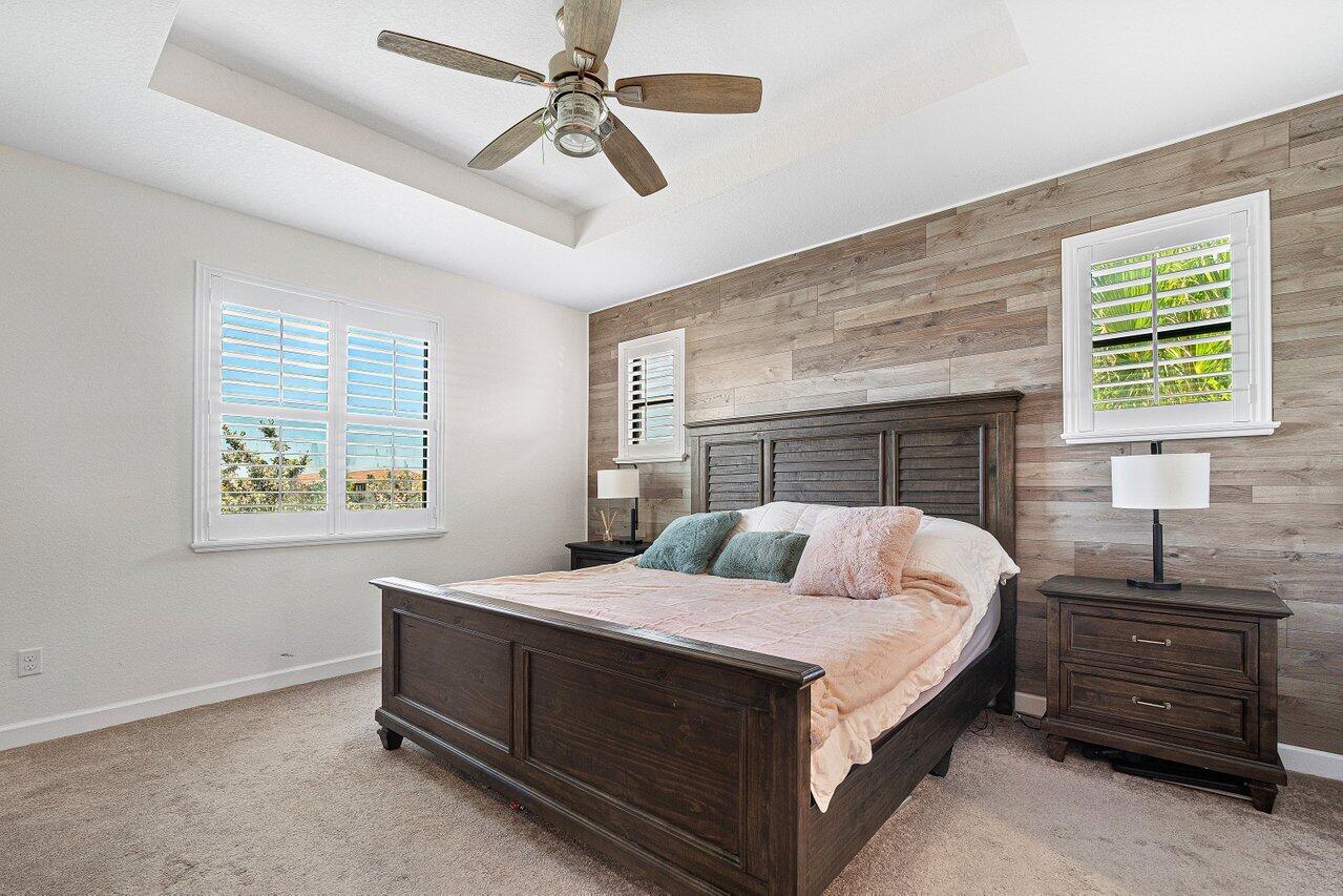 12949 Anthorne Lane Boynton Beach, FL 33436 - Photo 21 of 37 a bedroom with a bed and a window