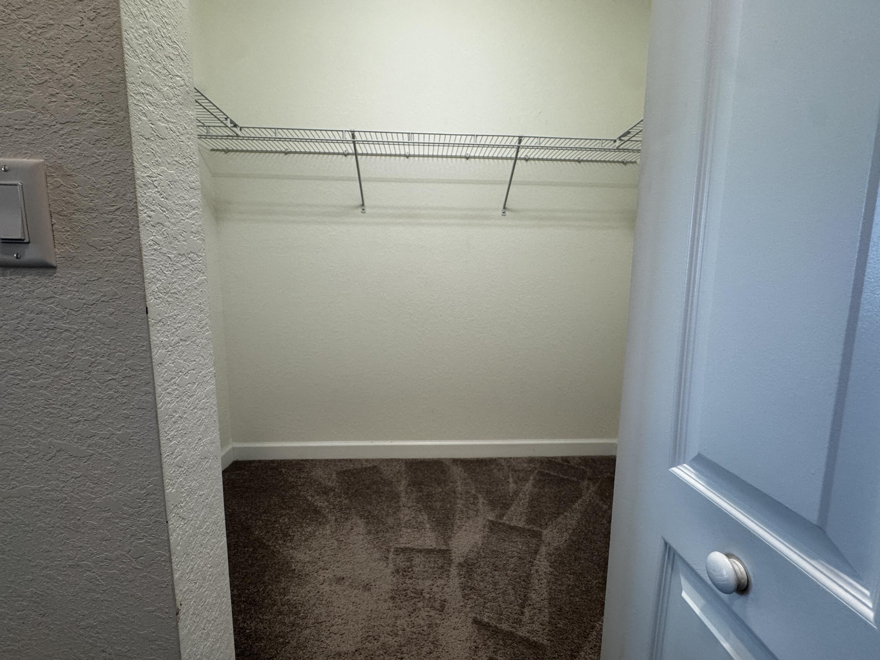12949 Anthorne Lane Boynton Beach, FL 33436 - Photo 23 of 37 a view of a room with racks on the wall
