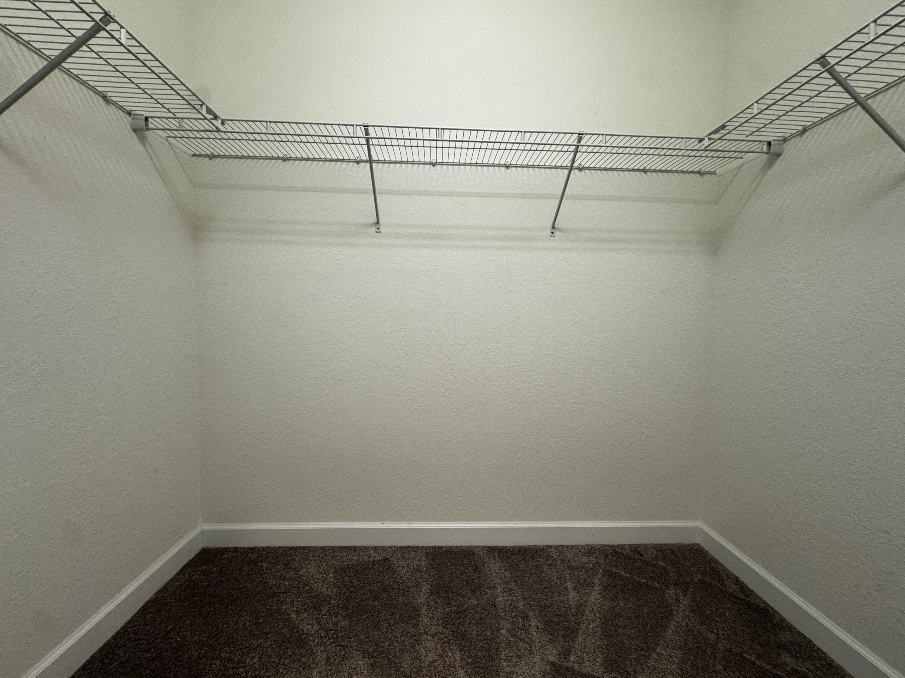 12949 Anthorne Lane Boynton Beach, FL 33436 - Photo 24 of 37 a view of a room with racks on the wall