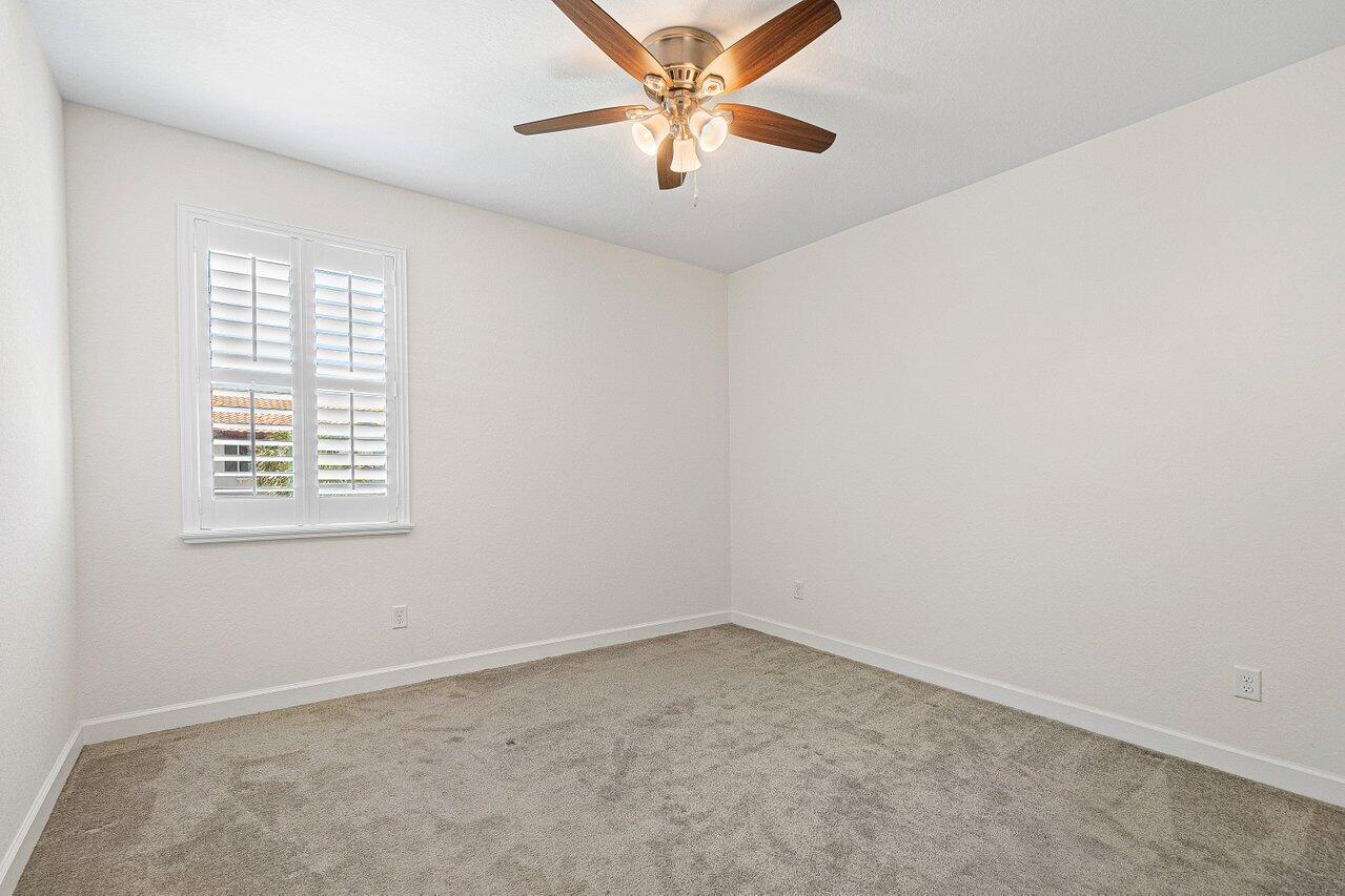 12949 Anthorne Lane Boynton Beach, FL 33436 - Photo 26 of 37 an empty room with a window and a fan