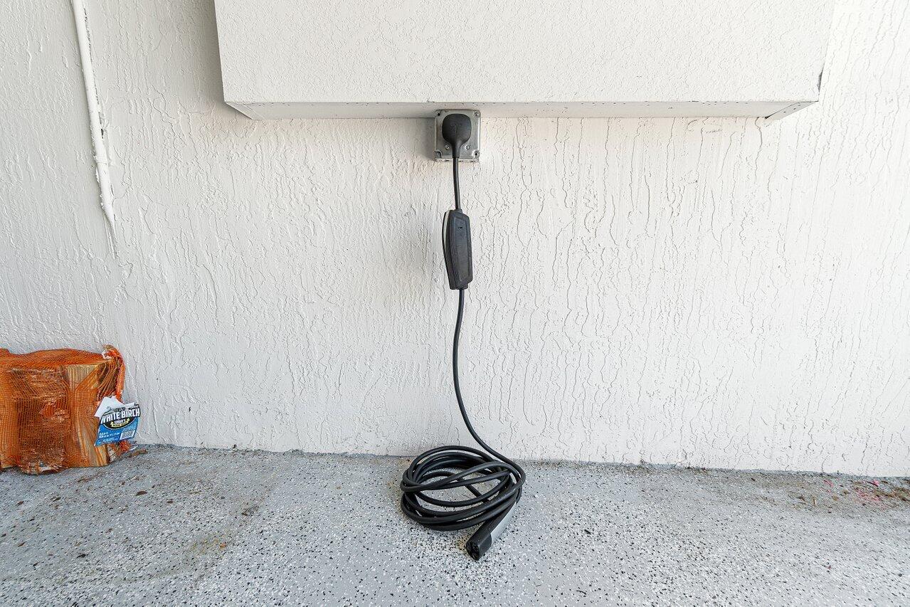 12949 Anthorne Lane Boynton Beach, FL 33436 - Photo 29 of 37 a picture of a room with stairs and a chandelier