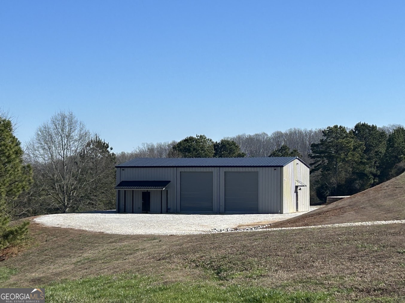 85 Blackjack Mountain Road Bowdon, GA 30108 - Photo 1 of 32 a front view of a house with a yard and garage