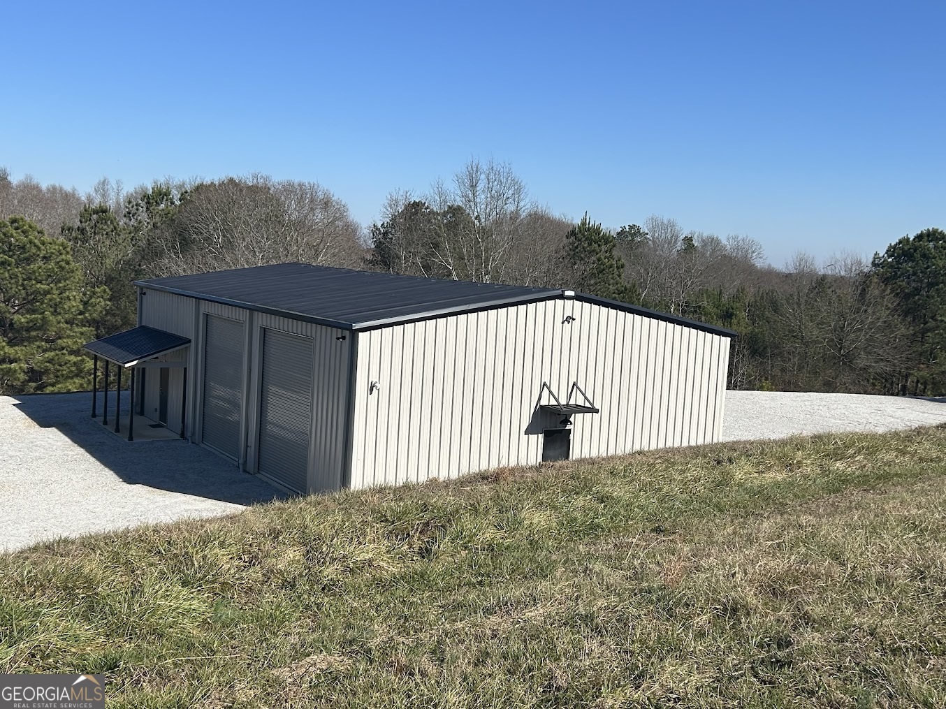 85 Blackjack Mountain Road Bowdon, GA 30108 - Photo 2 of 32 a view of a backyard