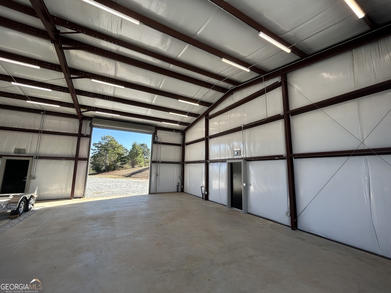 85 Blackjack Mountain Road Bowdon, GA 30108 - Photo 30 of 32 a view of an empty room with a window