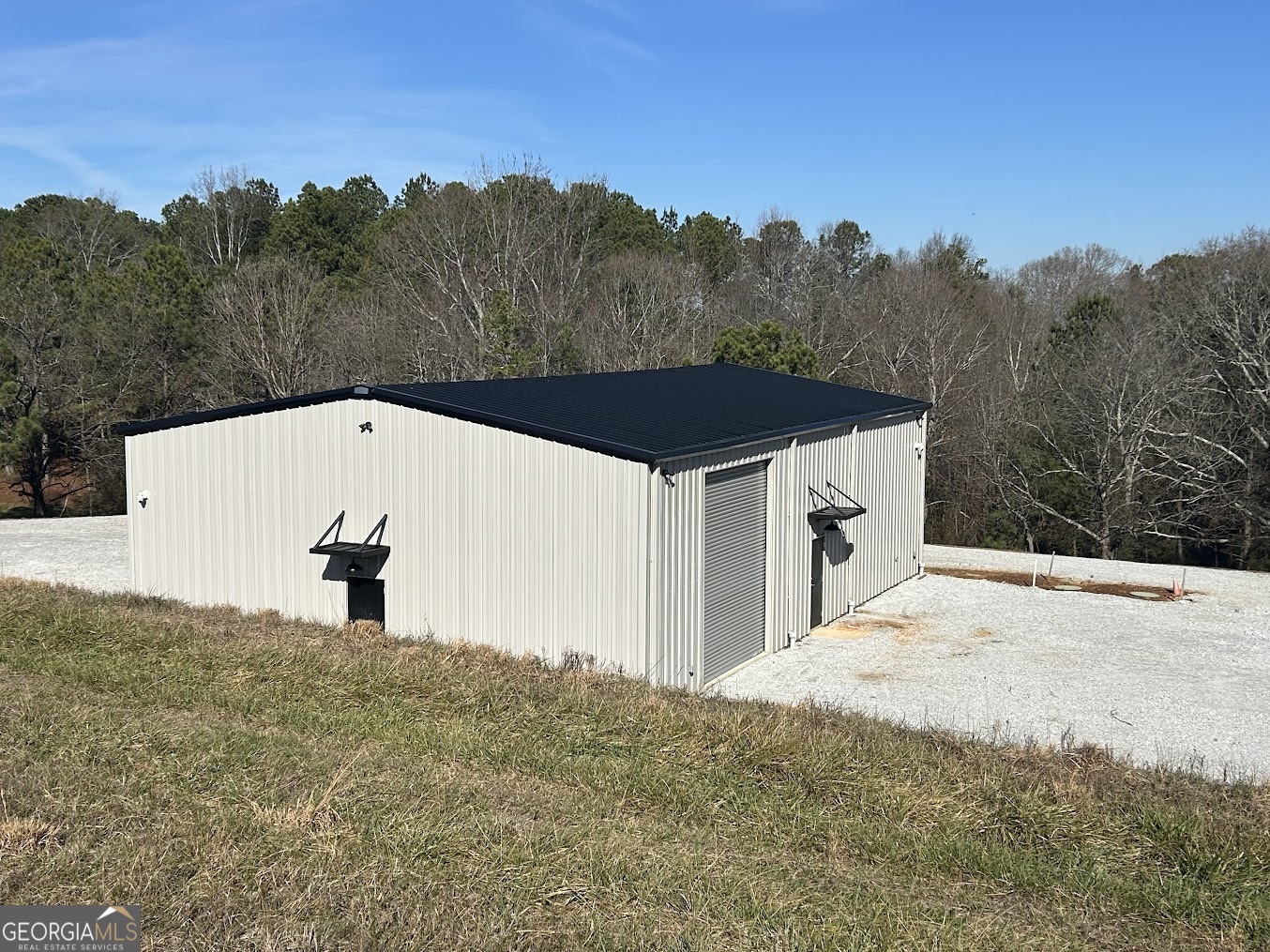 85 Blackjack Mountain Road Bowdon, GA 30108 - Photo 3 of 32 a view of a white house and a mountain view