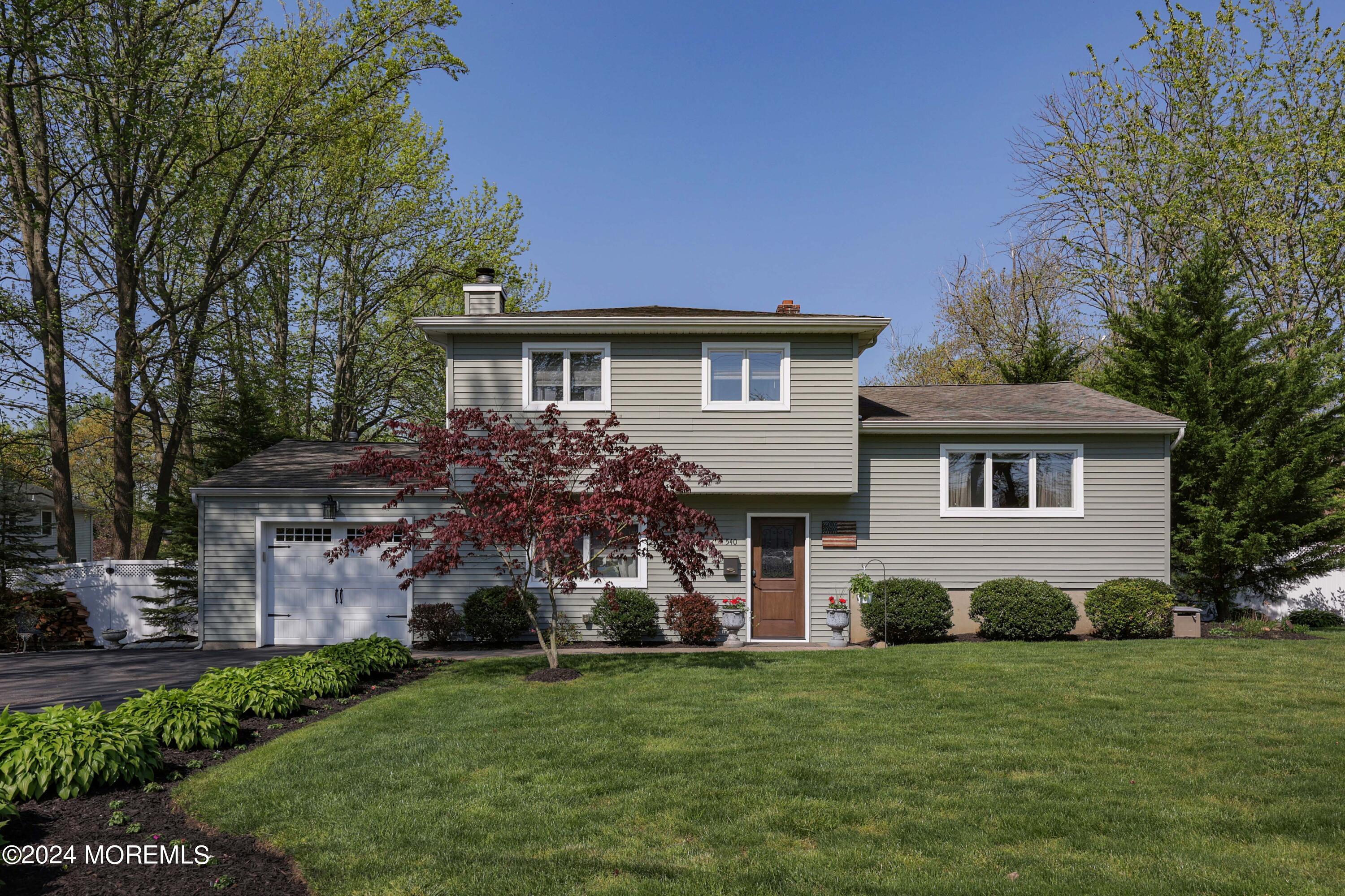 540 E Road Belford, NJ 07718 - Photo 1 of 55 a front view of a house with a garden