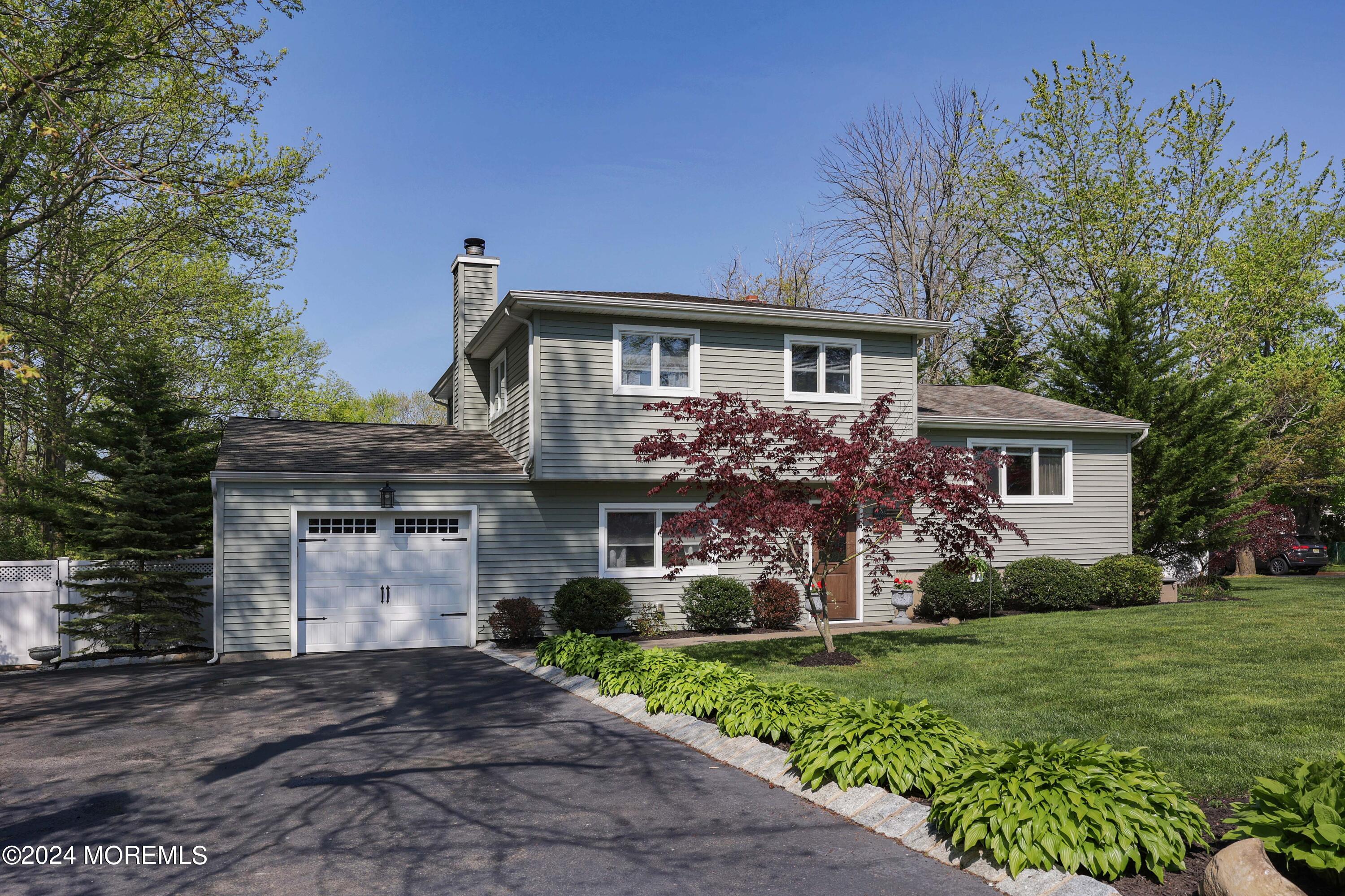 540 E Road Belford, NJ 07718 - Photo 4 of 55 a front view of a house with garden