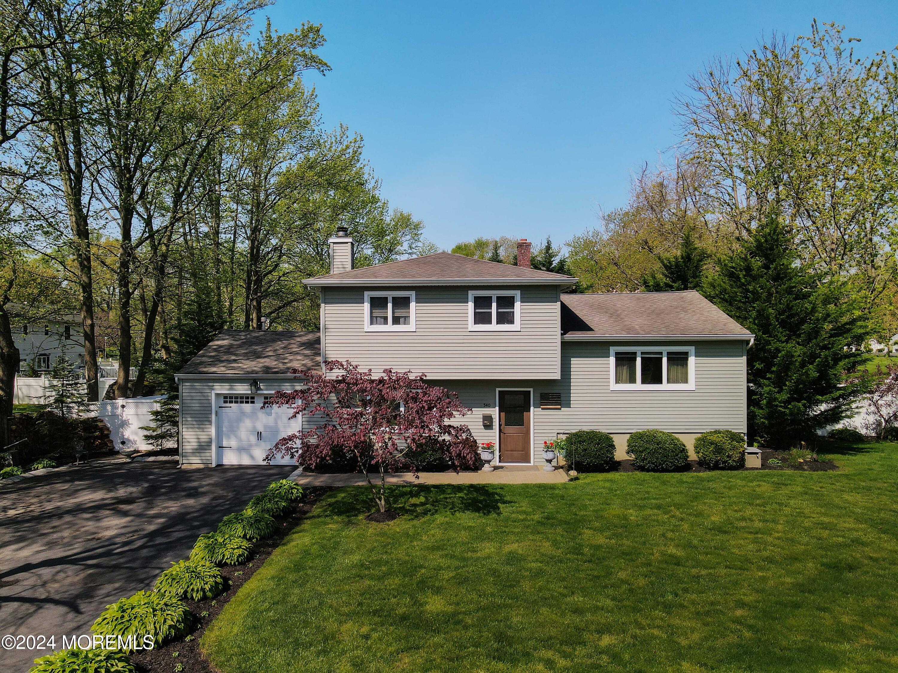 540 E Road Belford, NJ 07718 - Photo 46 of 55 a front view of a house with a garden