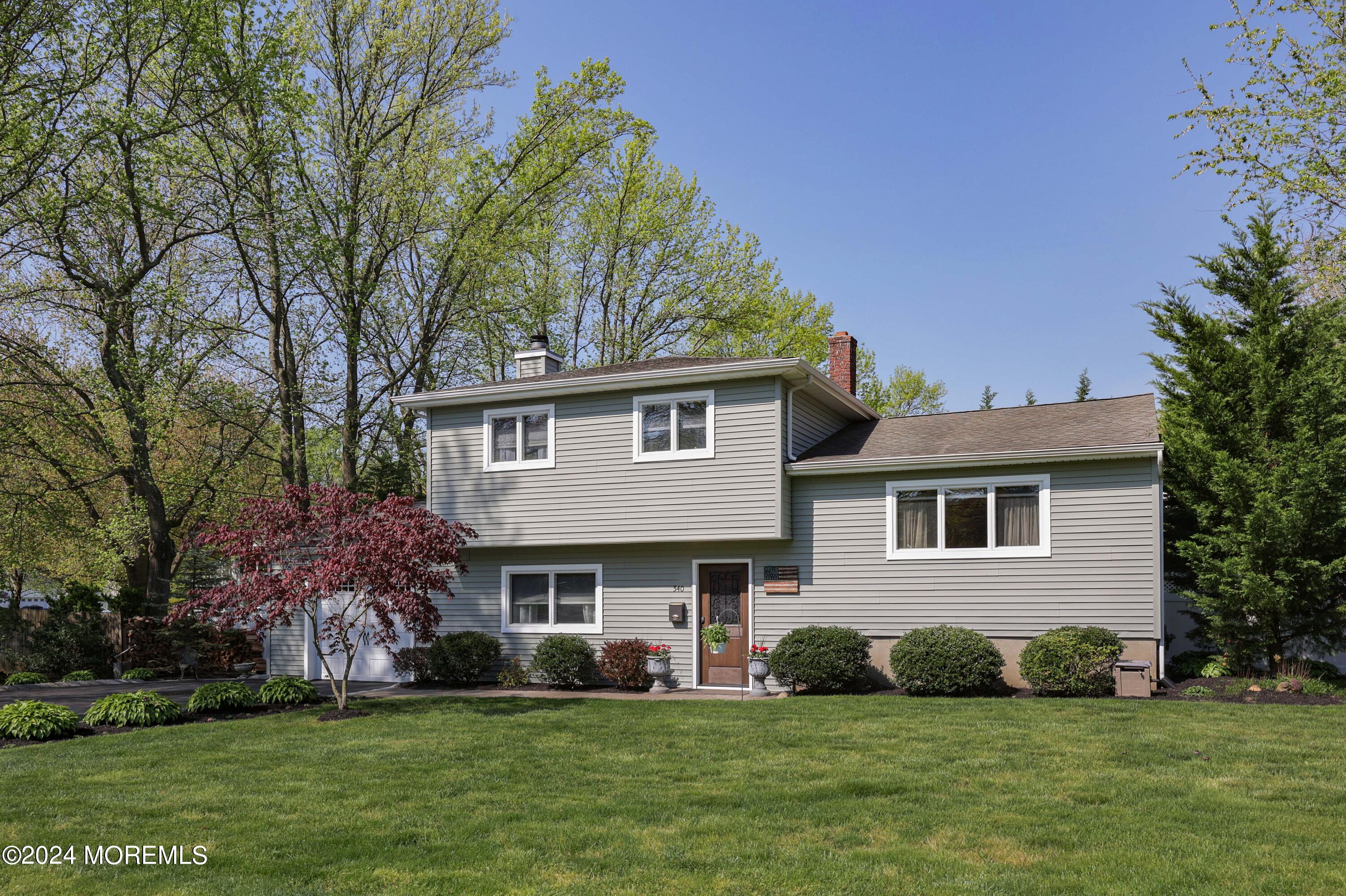 540 E Road Belford, NJ 07718 - Photo 5 of 55 a front view of a house with a garden
