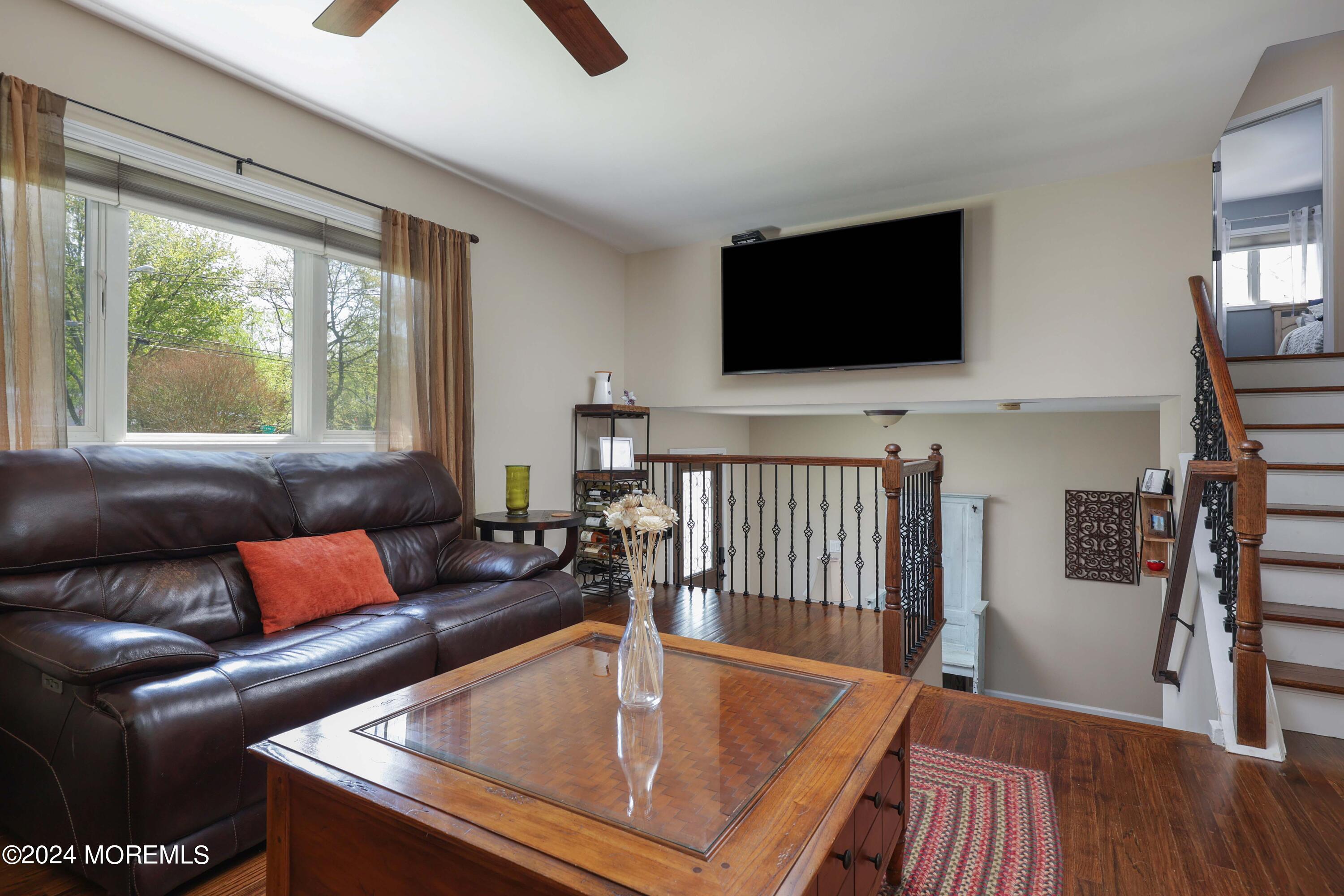 540 E Road Belford, NJ 07718 - Photo 8 of 55 a living room with furniture and a flat screen tv