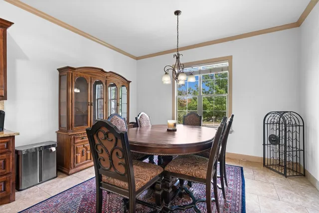 a kitchen with granite countertop stainless steel appliances and refrigerator