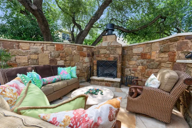 a view of a house with swimming pool and sitting area