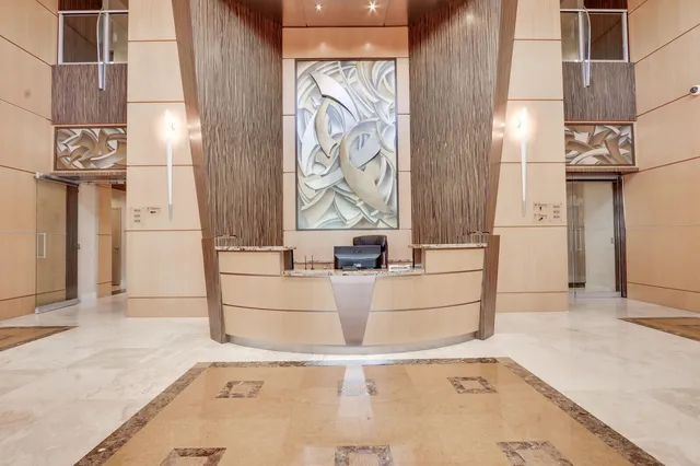 a view of an empty room with windows and city view