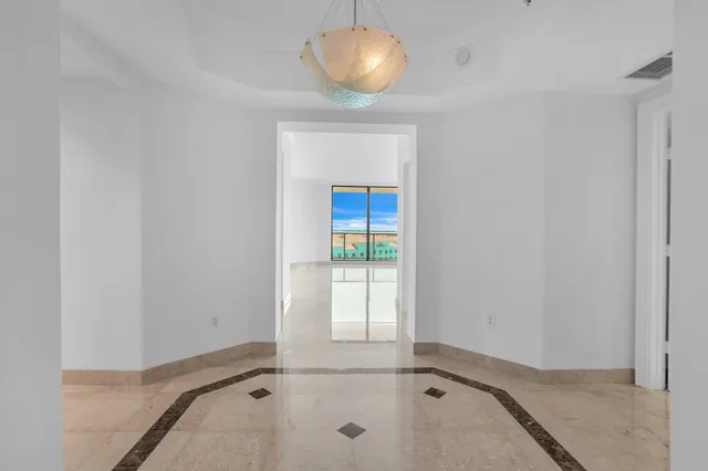 a view of an empty room with a large window