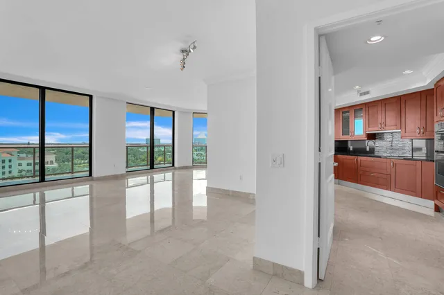 a kitchen with stainless steel appliances granite countertop wooden cabinets and a sink
