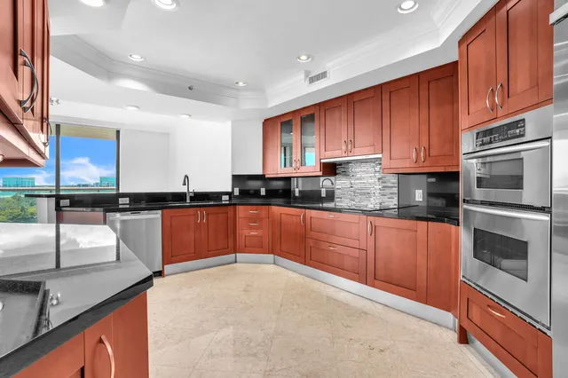 a spacious bathroom with a granite countertop sink mirror and double