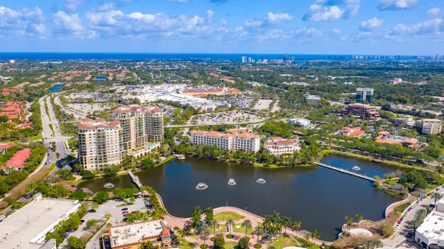 an aerial view of city and lake