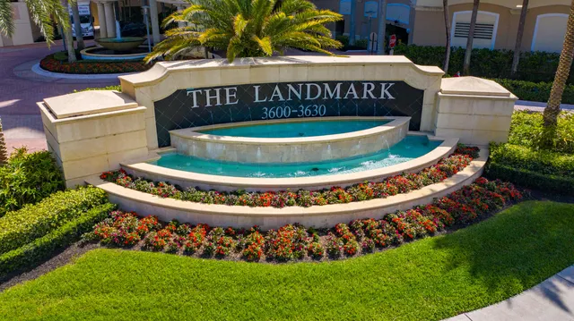 a view of a kitchen with refrigerator and cabinets