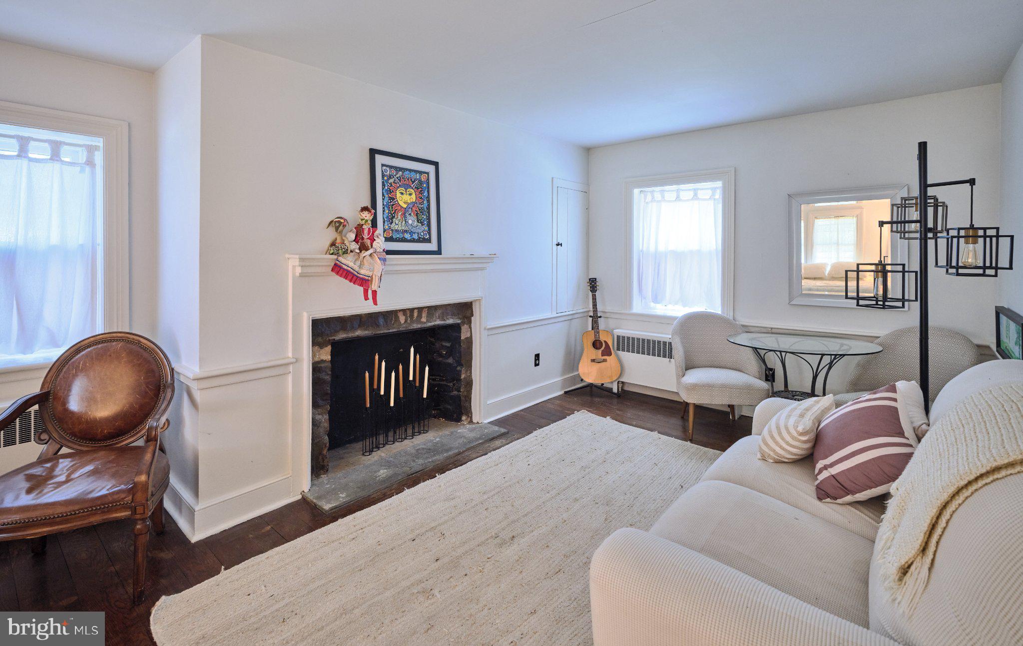765 Swamp Road Newtown, PA 18940 - Photo 19 of 37 a living room with furniture and a fireplace