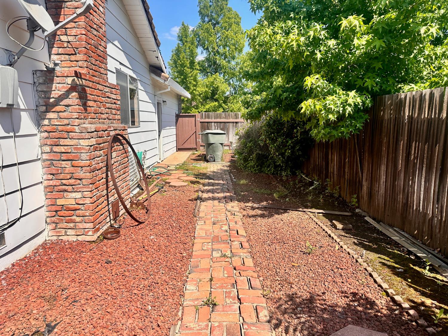3207 Terry Way Carmichael, CA 95608 - Photo 32 of 36 a view of backyard with wooden fence and large trees