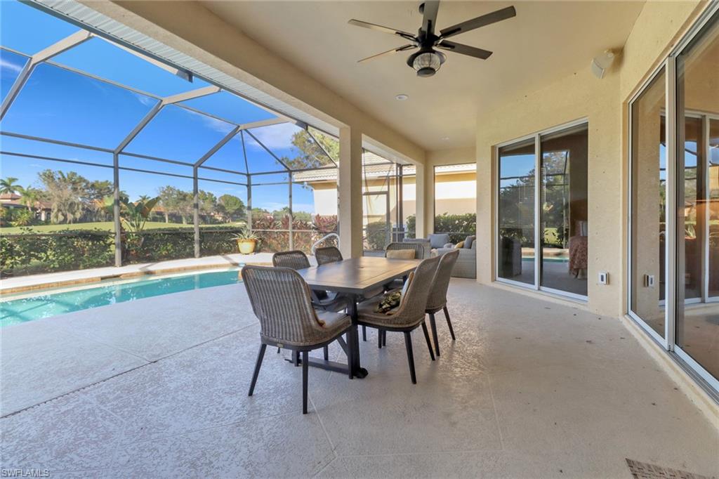6757 Bent Grass Drive Naples, FL 34113 - Photo 22 of 27 a view of a dining room with furniture window and outside view