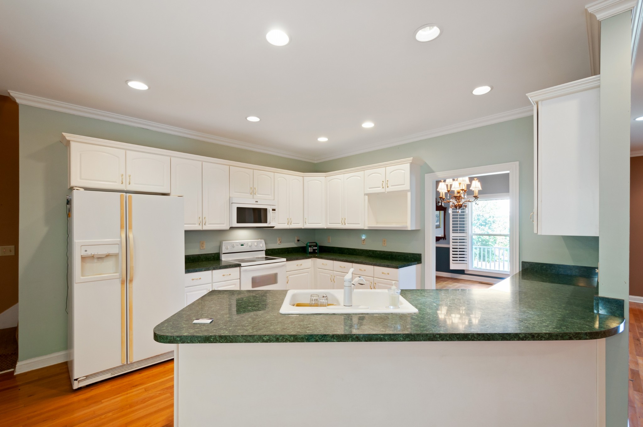 1741 Dean Road Thompson's Station, TN 37179 - Photo 17 of 54 a kitchen with stainless steel appliances granite countertop a sink a refrigerator and a granite counter tops