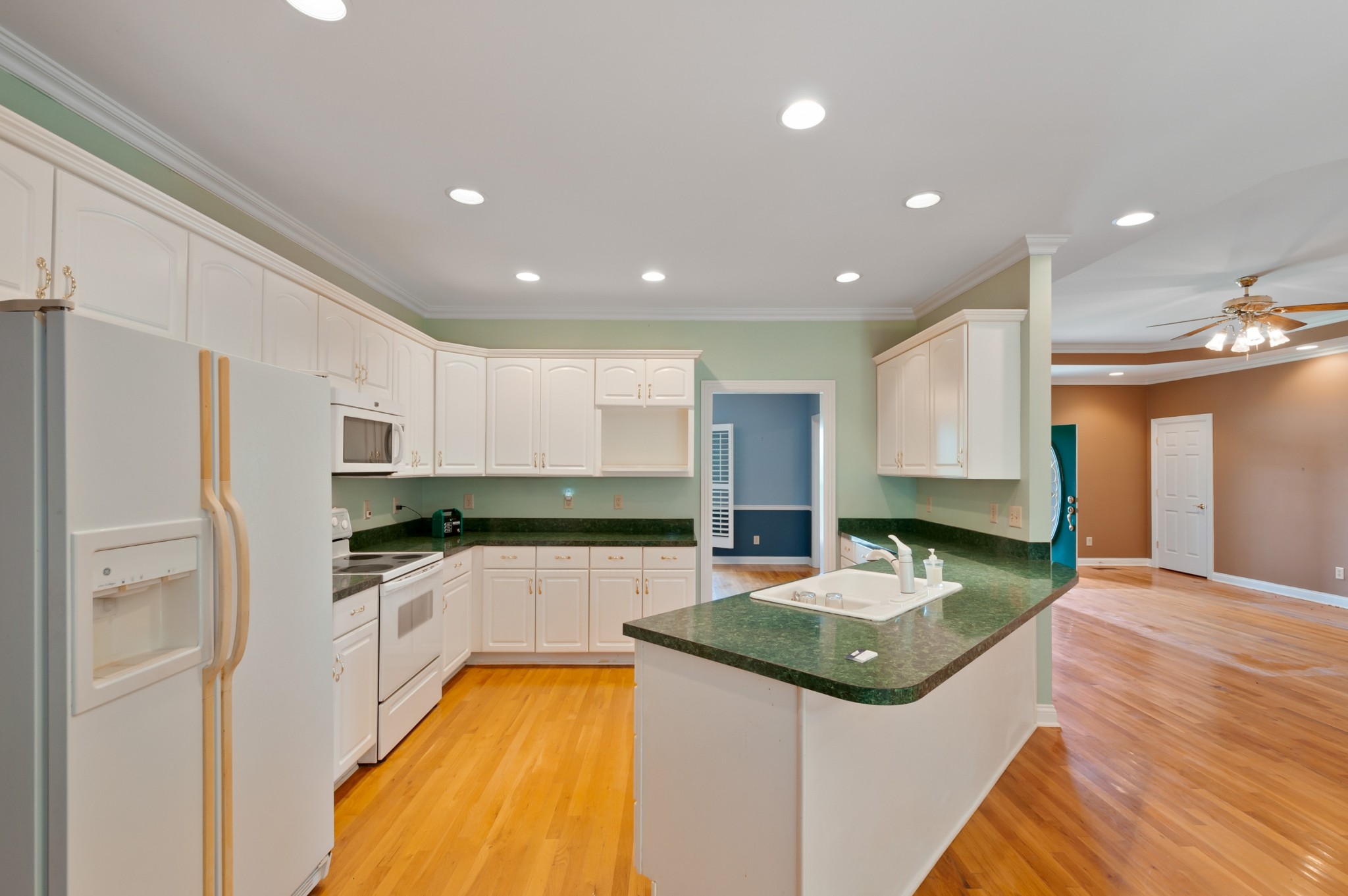 1741 Dean Road Thompson's Station, TN 37179 - Photo 18 of 54 a kitchen with stainless steel appliances granite countertop a sink and a stove