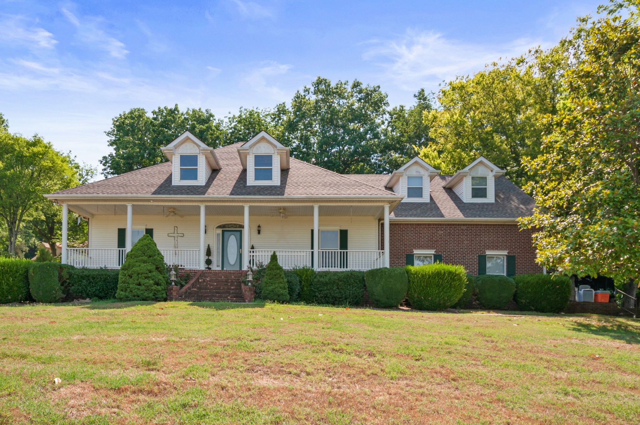 1741 Dean Road Thompson's Station, TN 37179 - Photo 3 of 54 a front view of a house with a yard and trees