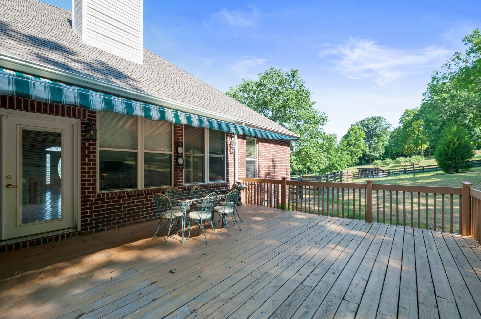 1741 Dean Road Thompson's Station, TN 37179 - Photo 41 of 54 a balcony with wooden floor table and chairs
