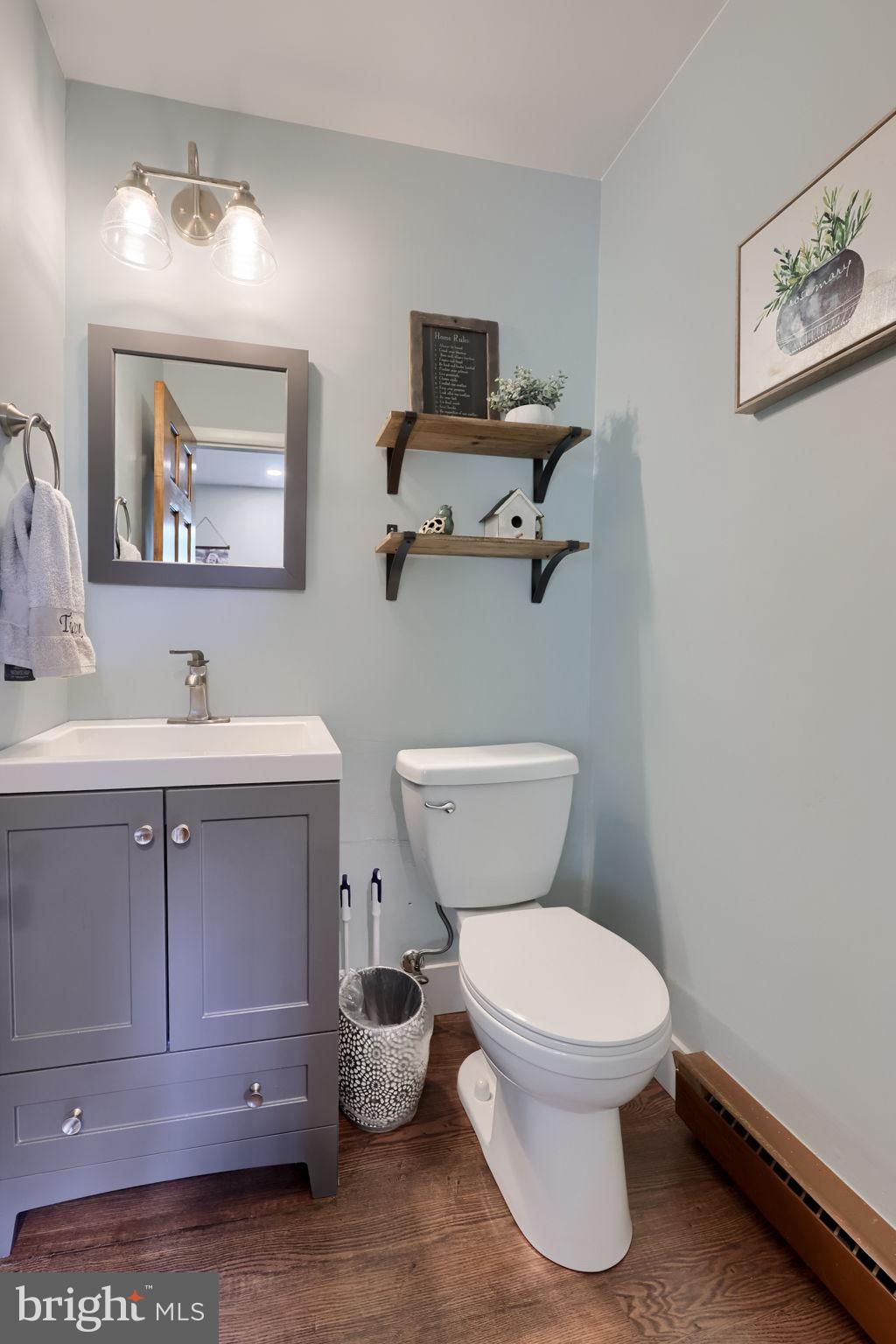 1019 Devonshire Road Lancaster, PA 17601 - Photo 16 of 35 a bathroom with a toilet sink and mirror