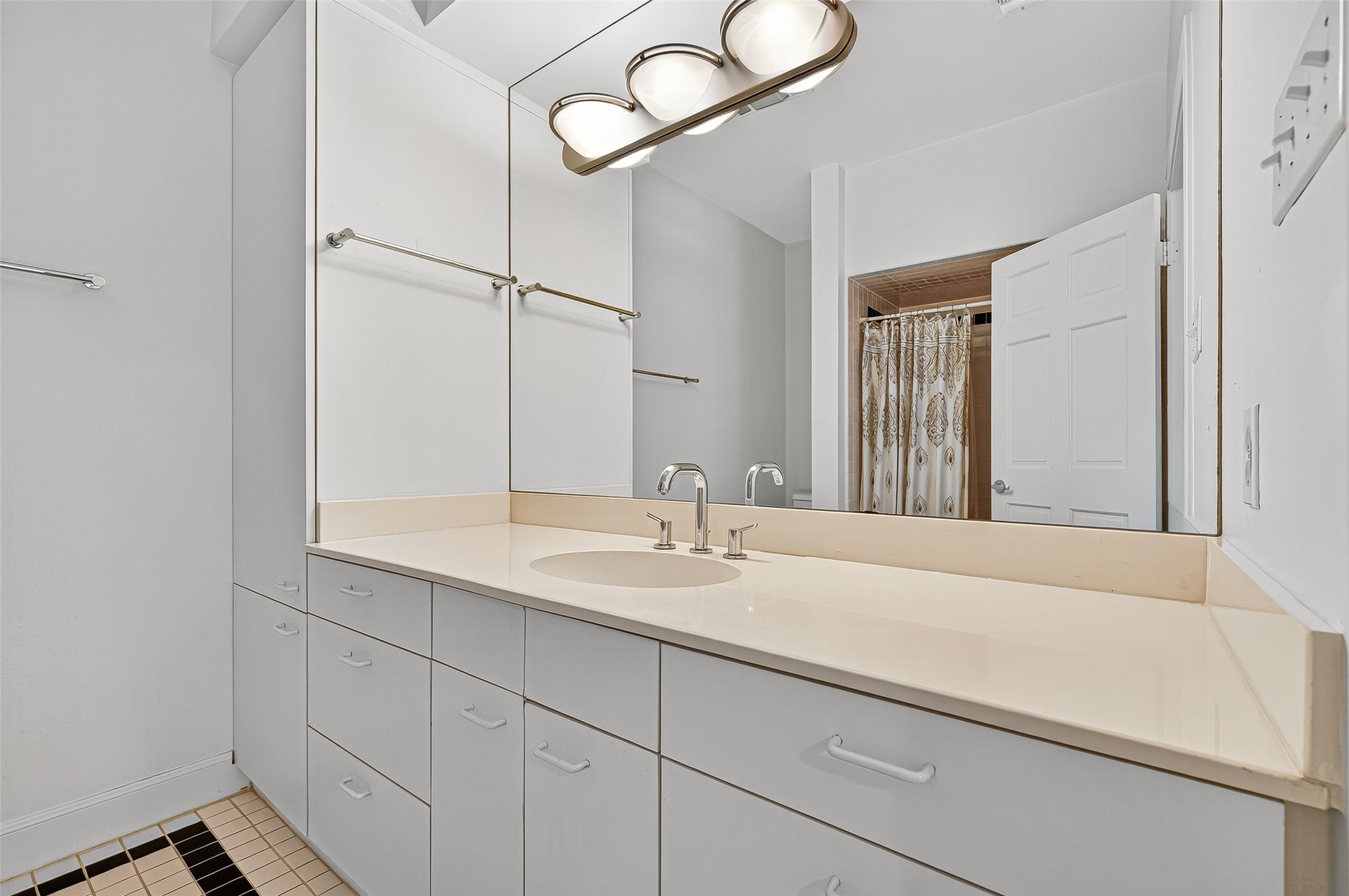 3027 Bissonnet Street Houston, TX 77005 - Photo 33 of 47 Secondary bath vanity with extended counter space — clean and ready to use