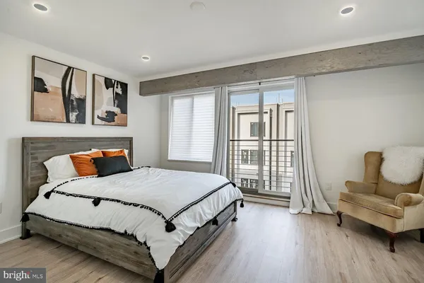 a bedroom with a bed and a couch